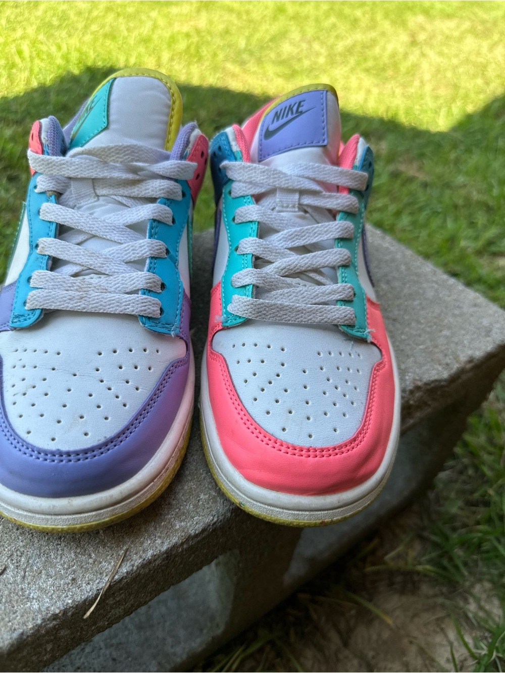 Nike Kids Low-Top Sneakers in White with Pink, Purple, Teal, and Yellow Accents